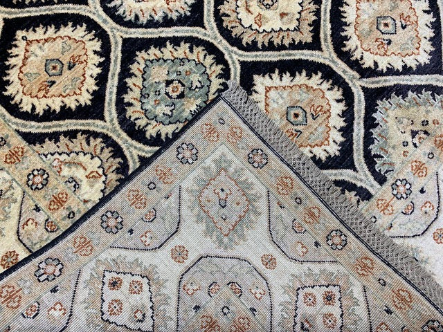6’7 x 9’5' Hand-Knotted Wool Rug – Black Field with Ivory/Beige Border